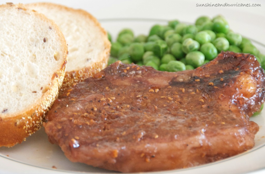 Want a super easy and totally delicious dinner recipe that your whole family will love? Mix together some sweet with a  touch of spicy and you've got a wining crockpot recipe that will become a regularly requested dinner in your household. Slow Cooker Raspberry Sriracha Pork Chops