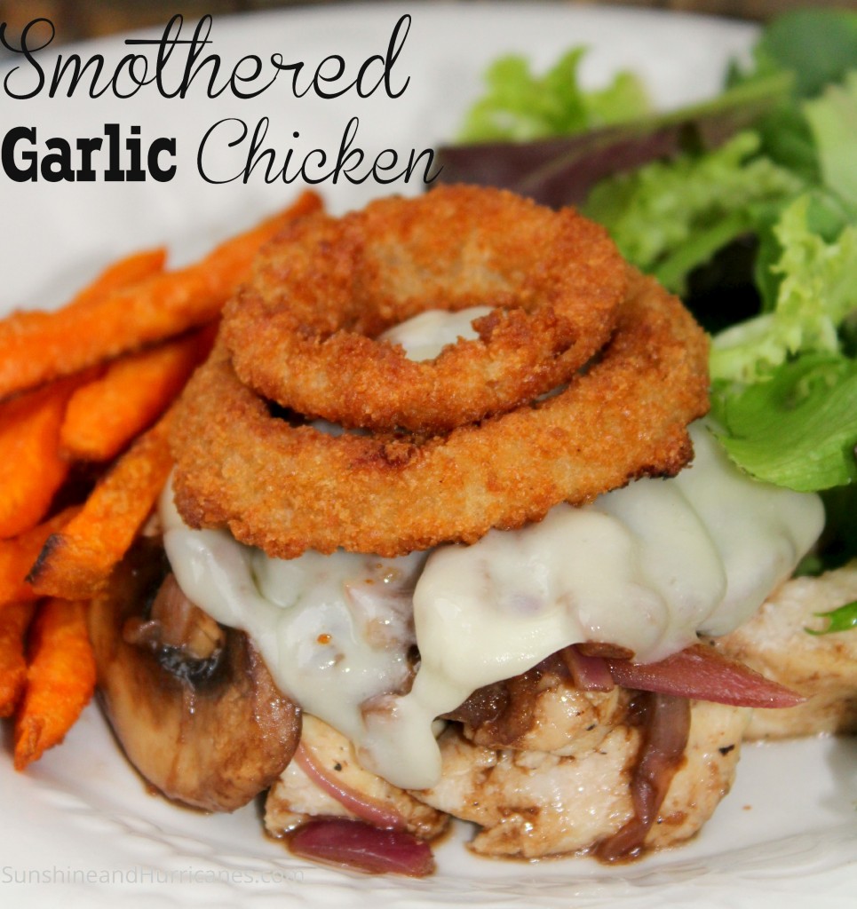 Smothered Garlic Chicken is a fast and easy dinner idea that is ready in 30 minutes or less! Serve with some delicious sweet potato fries and salad!